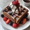 Schokoladenwaffeln Rezept Zutaten: - 1 ½ Tassen Mehl - 1 Tasse Zucker - ½ Tasse Kakaopulver - 1 Teelöffel Backpulver - 1 Teelöffel Natron - ½ Teelöffel Salz - 2 große Eier - 1 ½ Tassen Milch - ½ Tasse Pflanzenöl - 1 Teelöffel Vanilleextrakt - 1 Tasse Schokoladenstückchen Anleitung: 1. Heizen Sie das Waffeleisen vor. 2. In einer großen Schüssel Mehl, Zucker, Kakaopulver, Backpulver, Natron und Salz vermengen. 3. In einer separaten Schüssel Eier, Milch, Pflanzenöl und Vanilleextrakt verquirlen. 4. Die feuchten Zutaten zu den trockenen Zutaten geben und gut vermengen. 5. Schokoladenstückchen unterheben. 6. Eine Kelle Teig in das vorgeheizte Waffeleisen geben und backen, bis die Waffel knusprig und durchgebacken ist. 7. Warm servieren und nach Belieben garnieren.